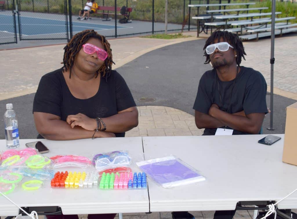 The welcoming table handed out party glasses, light up rings and light up bracelets to all partygoers.