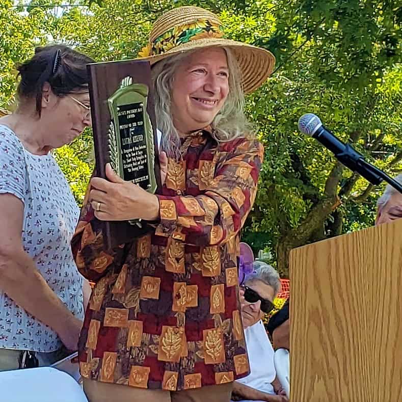 Laura Eisner displays award