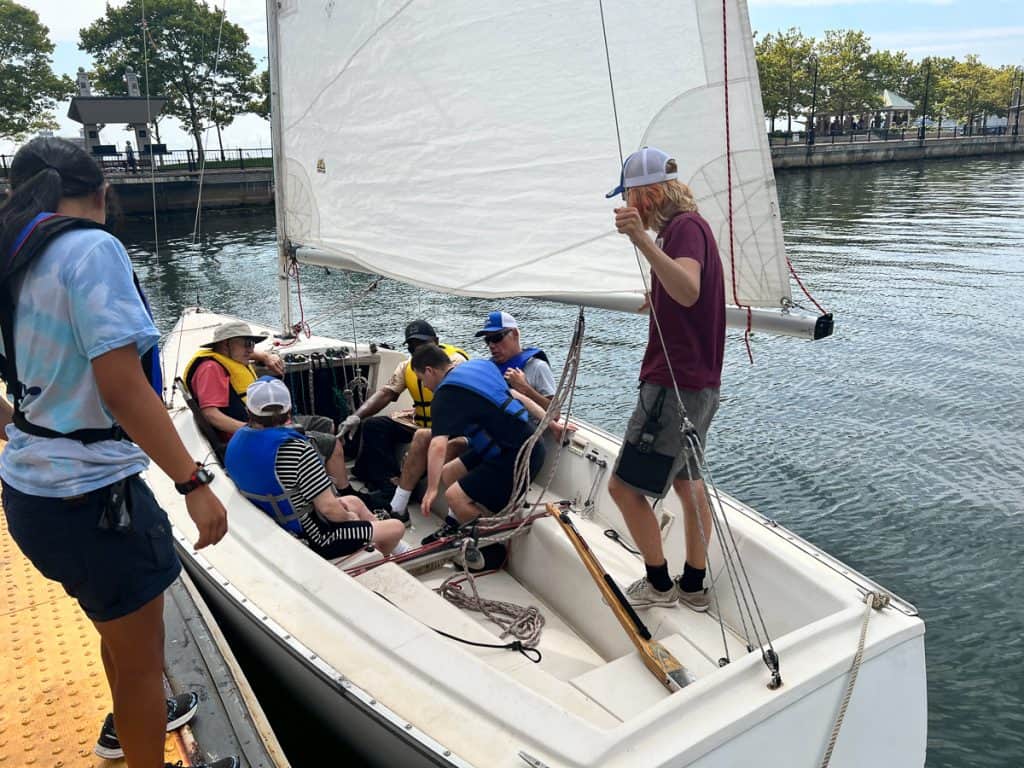 Staff helping residents into boat