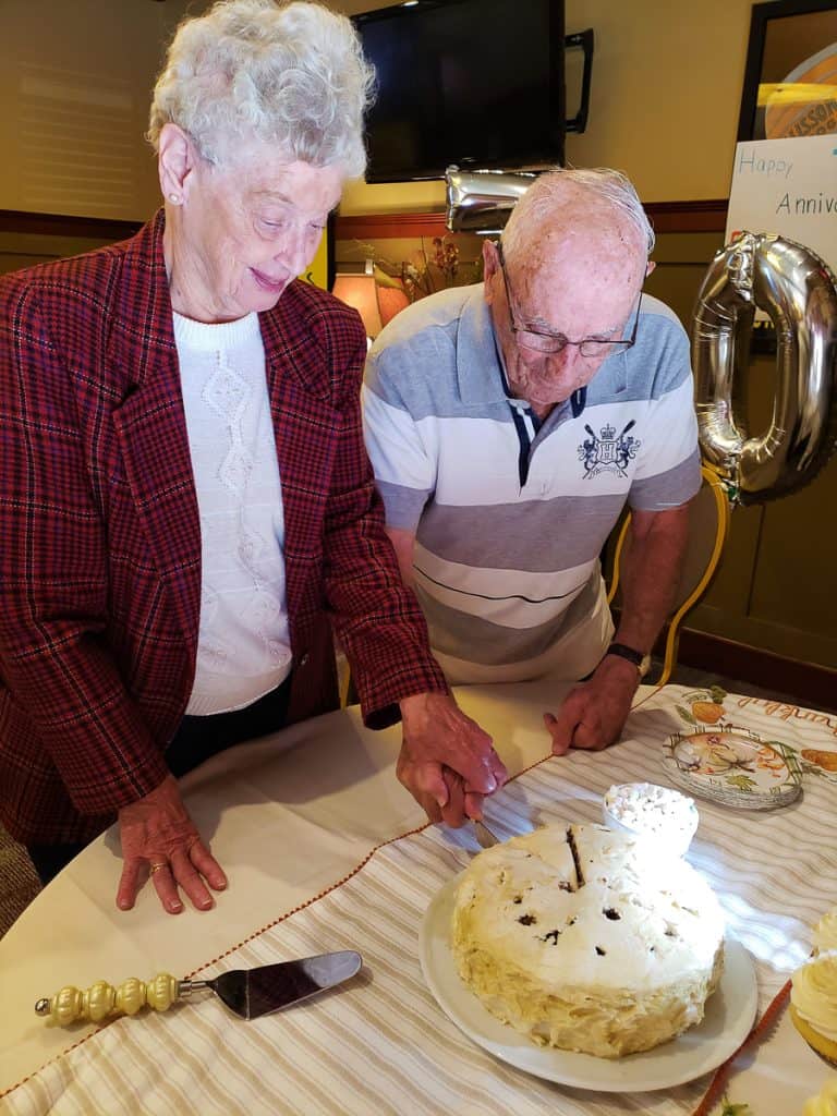 Arlene helps Eugene cut their 70th wedding-2