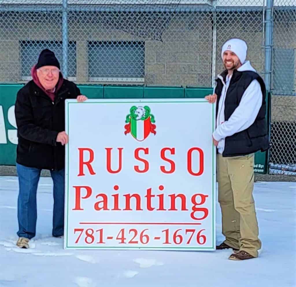 SUPPORTING LOCAL BASEBALL Left to right, World Series Park Superintendent Bob Davis and Joe Russo, owner of Russo Painting, hold the sign that will be displayed at the park-2