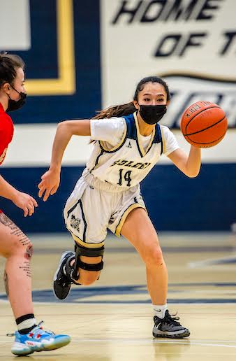 malden_s kimberly vo drives to the basket against Everett