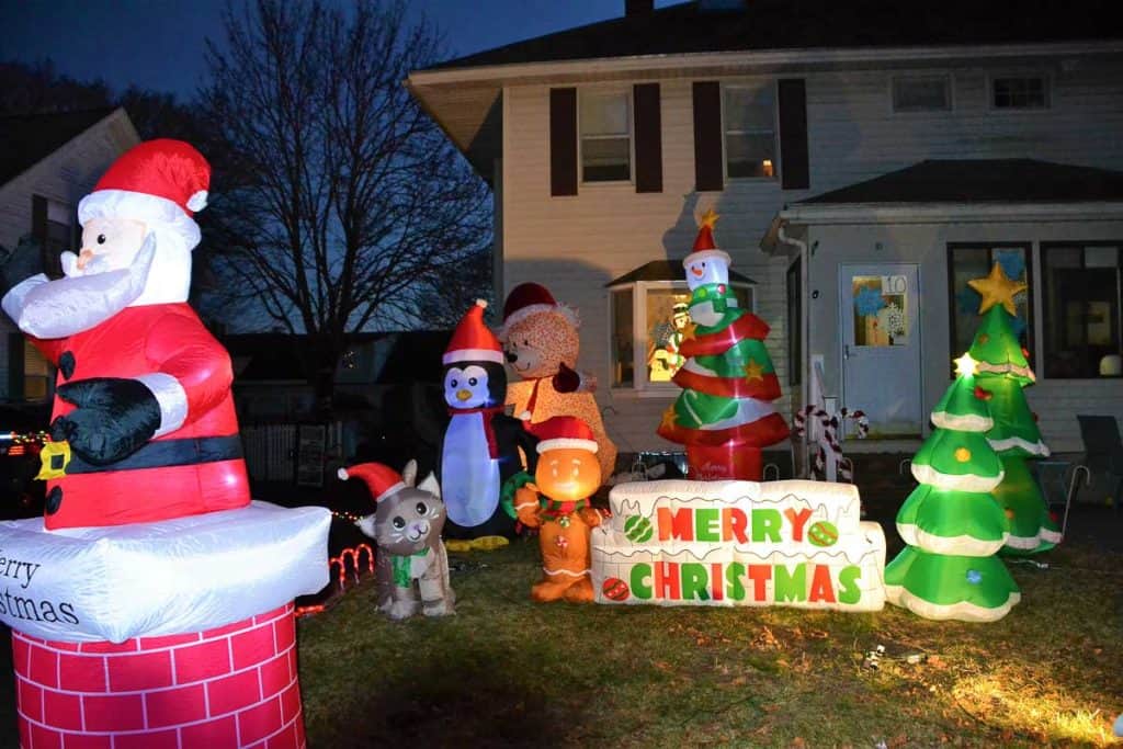 HOLIDAY FRIENDS A snowman tree, teddy bear, gingerbread man, penguin, cat, and Santa himself on the lawn of Tonya Chadwick wish everyone a Merry Christmas-2