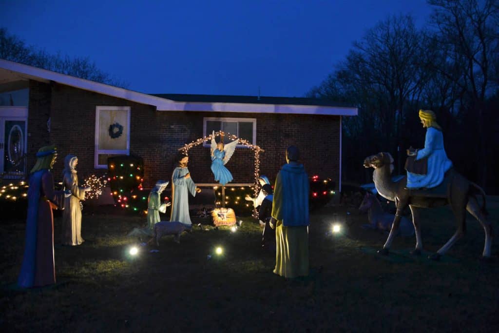 HOLY NIGHT The life size nativity scene at the Palma family home near Forest Street rode here several years ago in a pick-up truck