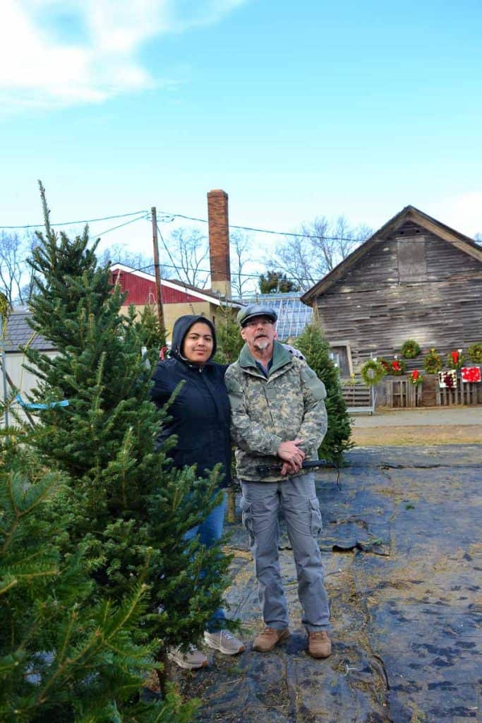 A FUN DECISION Paul Kenworthy and niece Monique Todd pick out the family Christmas tree at Huberman_s on Vine Street-2