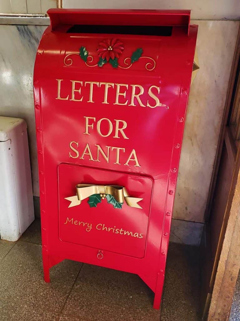 ROOM FOR MORE LETTERS Santa Claus’ red metal mailbox in the lobby of the Saugus Post Office in Cliftondale is much wider and taller than the one that stood there last year-2