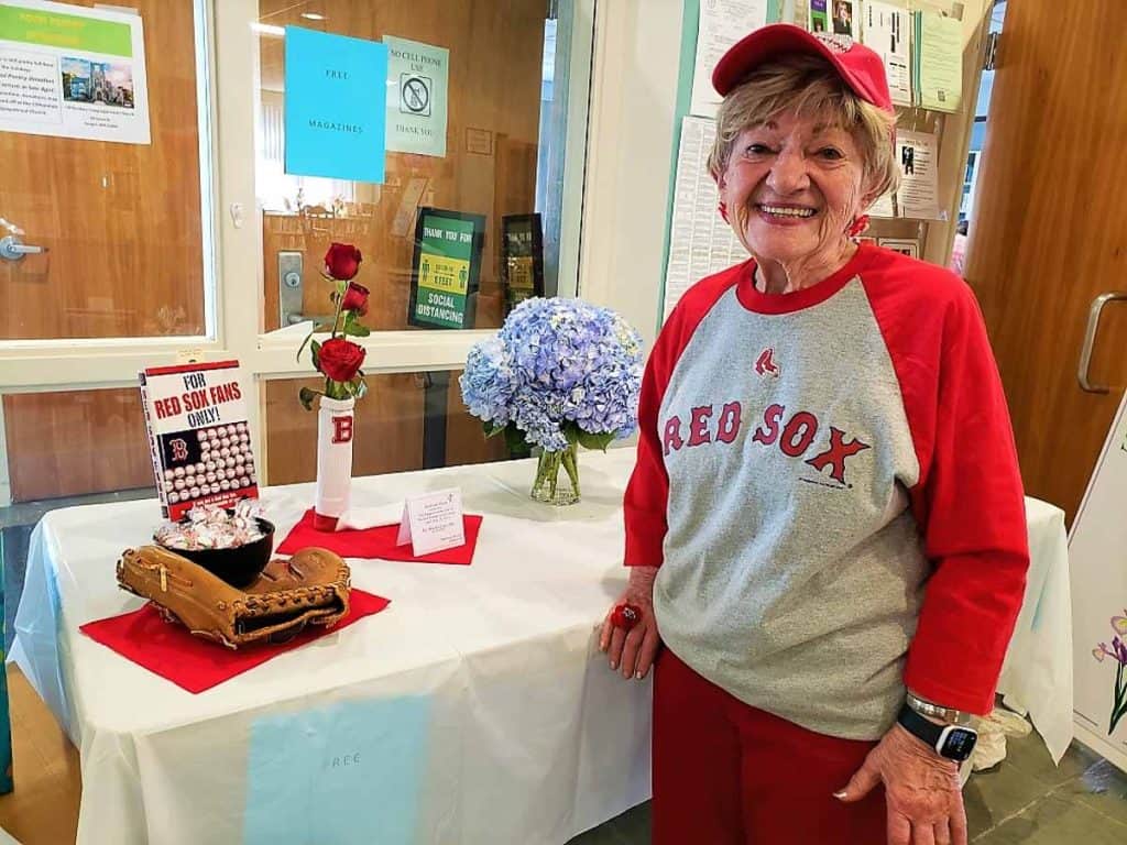 Showing off her Boston Red Sox fan loyalty