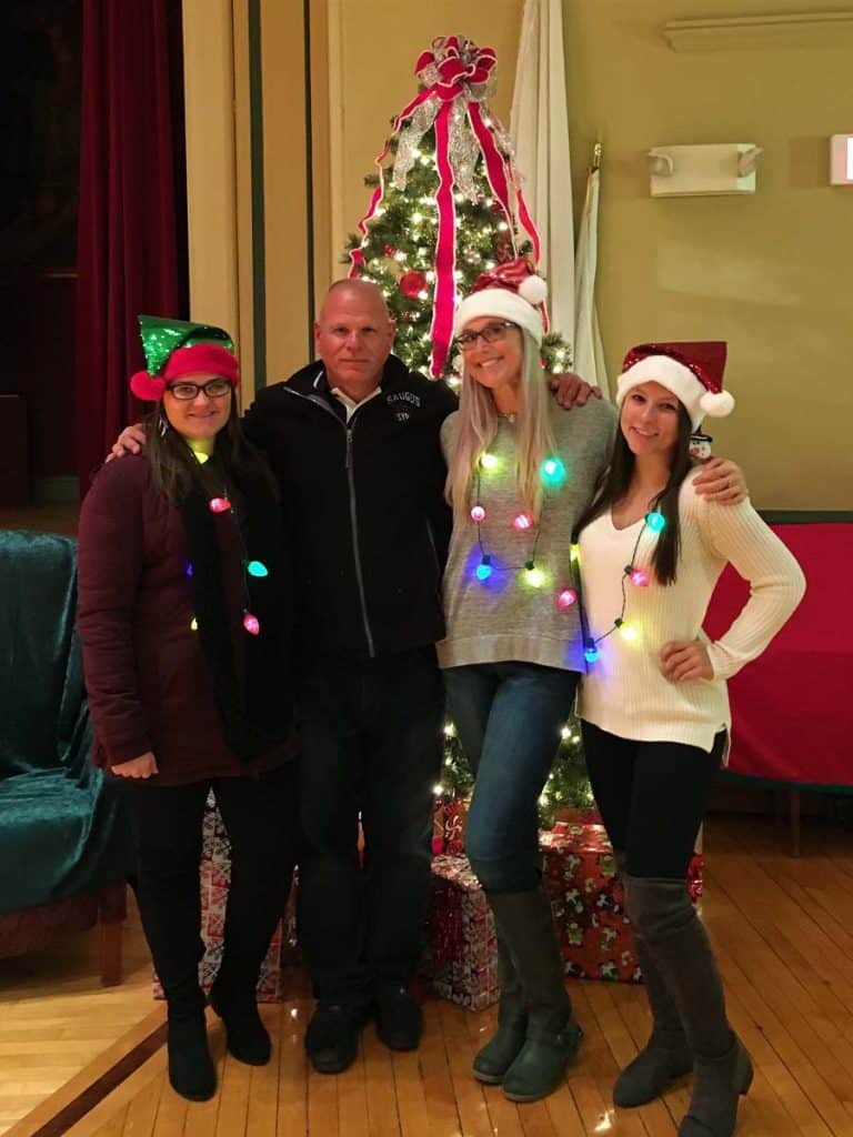 THE TEAM Left to right, Youth _ Recreation Department staff Emily Grant, Greg Nickolas, Crystal Cakounes and Emily Kay relax at a previous town tree lighting ceremony and festivities event
