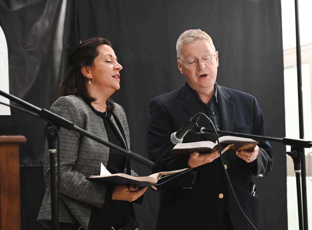 Vocalist Scott Best and Andrea Tracey singing Amazing Grace. _