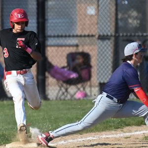 Albert Santana safely makes it to first base during GBL action against Revere.
