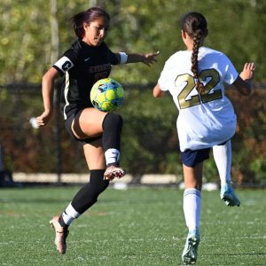 Lady Tide’s Yelsa Garcia with the ball scored all five goals against Malden recently.  (Advocate file photo)