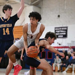 The Pats’ Amir Yemani battled against two Lynnfield defenders as he tried to make a play during recent action. (Advocate file photo)