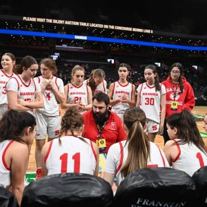 Saugus girls basketball Head Coach Joe Lowe goes over pregame strategy with his team before the Sachems’ game with Marblehead at the TD Garden for the annual Andrew James Lawson Invitational Tournament. (Advocate file photos)