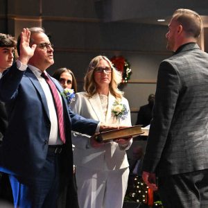 NEW CHAPTER: Mayor Robert Van Campen is joined by Everett’s First Lady, Lisa Van Campen, his son John and daughter Lily on stage as he is sworn in as Everett’s next Mayor by City Clerk Sergio Cornelio. See photo highlights inside. (Advocate photos by Emily Harney)