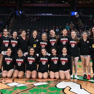 26.	The Saugus girls varsity basketball team poses for a photo at center court of the TD Garden in Boston for the annual Andrew James Lawson Invitational Tournament.