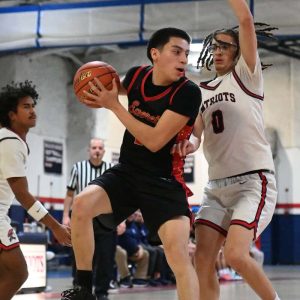 ROAD WIN: Everett’s Cristian Vasquez grabs the rebound during the Tide’s 78-35 win this week.  (Advocate photo by Emily Harney)