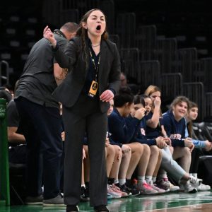 Patriots’ Varsity Head Coach Ariana Rivera is shown courtside during the annual Andrew James Lawson Foundation 2024 Invitational at the TD Garden against Notre Dame Academy.