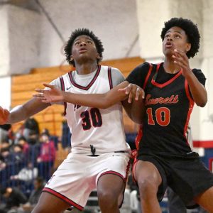 Bryan David battles for position under the net.