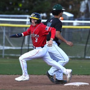ON THE MOVE: Domenic Bellia rounds second base during Monday’s action in Revere.  (Advocate photo by Emily Harney)