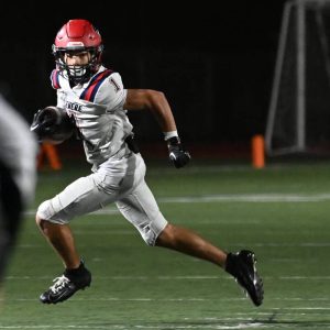 Revere’s Geo Woodward on the carry during their recent win against Malden. (Advocate file photo)