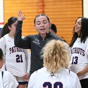 RHS girls’ varsity basketball Head Coach Ariana Rivera talks with her team during half-time against Malden last season.  (Advocate file photo)