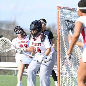 The Crimson Tide’s Olivia Dresser battled for the ball in the outfield during Everett’s recent high-scoring road win over Lynn English, 24-11.