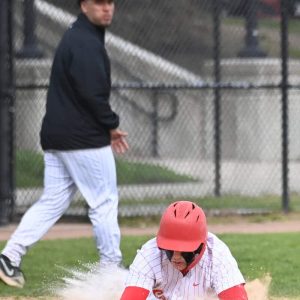 Sliding into home plate was MJ Guida during recent action against Malden.