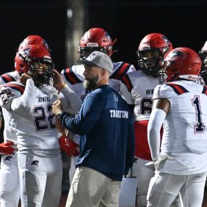 RHS Patriots Football Head Coach Lou CicateIIi talked with his team before halftime during last year’s season opener against the Peabody Tanners. (Advocate file photo)