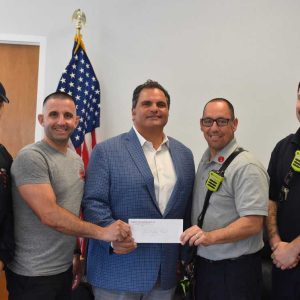 Pictured from left to right: Firefighter Robinson Tran, Firefighter Adam Ragucci, Mayor Carlo DeMaria, Lt. Craig M. Hardy and Firefighter Matthew Invernizzi.