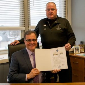 Mayor Robert J. Van Campen and Capt. Paul Landry holding the signed Statement of Support for the Employer Support of the Guard and Reserve (ESGR).