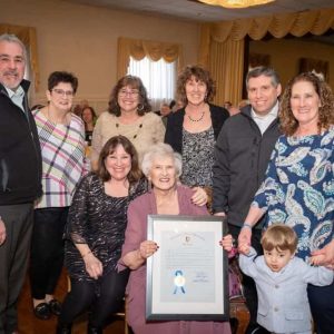 State Representative Joe McGonagle, Judy Parisi, Lilian Doughty, Elizabeth Burke, Senator Sal DiDomenico, Carol Panarese, Wilder Panarese; sitting down are Mary LeBlanc and Concetta “Connie” Parisi (Courtesy photo)