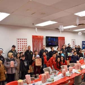 Everett police officers and firefighters joined alongside Eliot Family Resource Center, Target and Cataldo Ambulance volunteers to take 34 kids holiday shopping at the Everett Target.