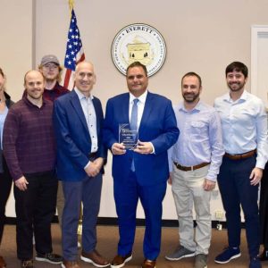 Massachusetts Institute for a New Commonwealth (MassINC) CEO Joe Kriesberg presented the 2024 Gateway Cities Innovation award to Mayor Carlo DeMaria and Planning & Development Department staff at Everett City Hall.