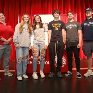 SHS Athletic Director Terri Pillsbury is shown with the Saugus Sachems students signing letters of intent: Jessica Bremberg, Violet Hawley, Isaiah Rodriguez, Tommy DeSimone and Braden Faiella.