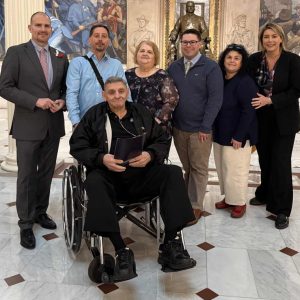 Shown from left to right: Councillor-at-Large Marc Silvestri, son Richard Serino, Jr., the late Richard Serino, Sr., wife Trudy Serino, grandson Richard Serino III, daughter-in-law Gina Serino and State Rep. Jessica Giannino at the State House last week.