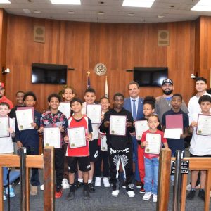 Mayor Carlo DeMaria alongside the fifth grade Travel Basketball team.