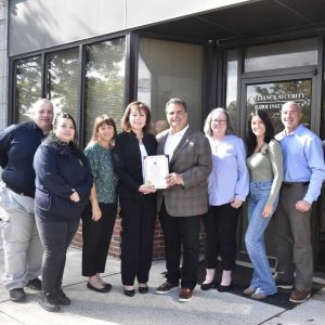 Mayor Carlo DeMaria presented a City of Everett Citation to President Marianne Jenkins in celebration of Alliance Security’s 50th anniversary. Pictured from left: Dave McKenzie, Rosa Alvarez, Angela Topham, President Marianne Jenkins, Mayor Carlo DeMaria, Don Cianculli, Tiffany Jenkins and Vice President Dale Jenkins.