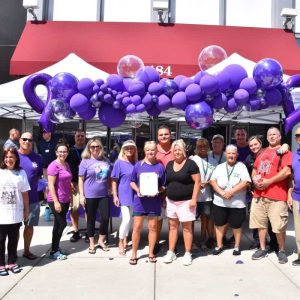 Event attendees gathered in front of City Hall to share information and resources for International Overdose Awareness Day.