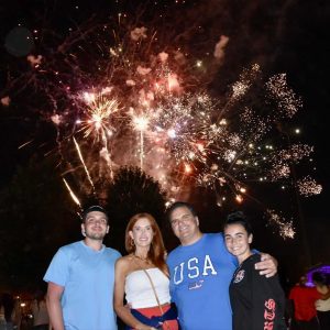 Mayor Carlo DeMaria and First Lady Stacy along with their son, Carlo and his girlfriend, Juliana are shown under the fireworks display at Glendale Park. (Photo courtesy of the City of Everett)