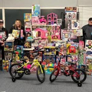 DiDomenico Foundation members, including Sen. DiDomenico and his wife, Trish (pictured), alongside the toys that they donated to the City of Everett’s annual Toy Drive.