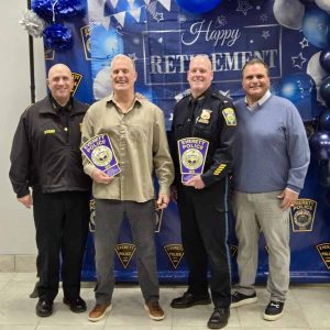 Shown from left to right: Everett Police Chief Paul Strong, Detective James Mason, Lieutenant Jeffrey Gilmore and Mayor Carlo DeMaria.  (Photo courtesy of the City of Everett)