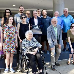 The Spivack family joined by the Everett Historical Commission, elected officials and City staff alongside the new sign commemorating the Park Theatre.