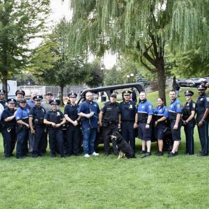 Everett police officers alongside Chief Paul Strong, Mayor Carlo DeMaria and Stacy DeMaria at National Night Out.