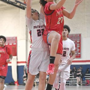 Everett’s Geordiell Luna Morales goes up for a basket in recent action against Revere.  (Advocate file photo)