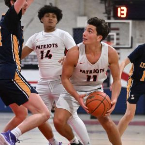 Revere Co-Captain Andrew Leone looked for an open teammate during recent action against Lynnfield. (Advocate file photos/Emily Harney)