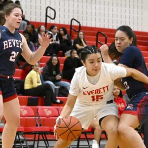 Lady Tide’s Katerin Landaverde drives her way past Revere defenders.  (Advocate photo by Emily Harney)