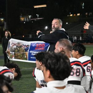 RHS Patriots Head Coach Louis Cicatelli’s family and friends were on hand to celebrate his 100th career win.  (Advocate photo by Emily Harney)