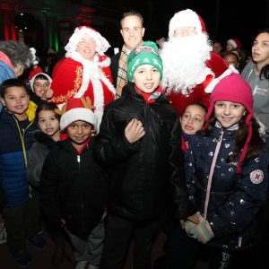 Mrs. Claus, Mayor Patrick Keefe and Santa paused for a photo-op with some of the hundreds of children at the tree lighting last Saturday evening.
