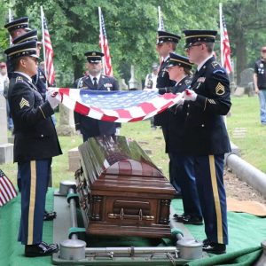 15:

Lord’s body is shown being laid to rest by the Honor Guard approximately 80 years later.