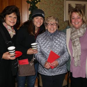 Karen Miguel, Pam Griffin, Teresa Griffin and Janet Colameta have fun after the tree lighting.